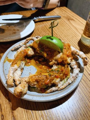 Kawari soft shell crab served with a lime wedge on a plate