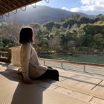 Side profile of girl sitting on the floor looking at the scenery